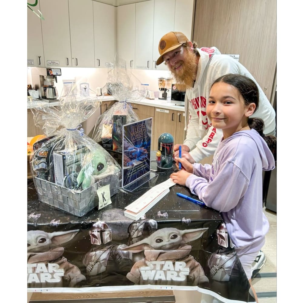 Rob Mashford and his daughter visit the Ronald McDonald House Family Room during Star Wars Day on May 4.